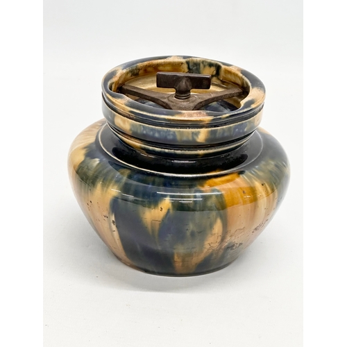 424 - A Late 19th/Early 20th Century glazed tobacco jar. Circa 1900. 14x11cm