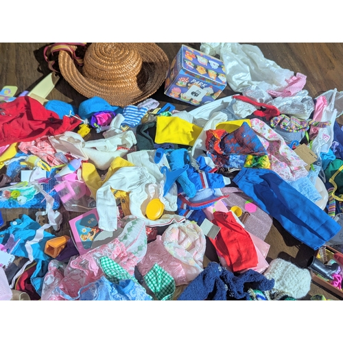 54 - A large collection of vintage doll clothes, accessories, etc. Barbie, Sindy, etc