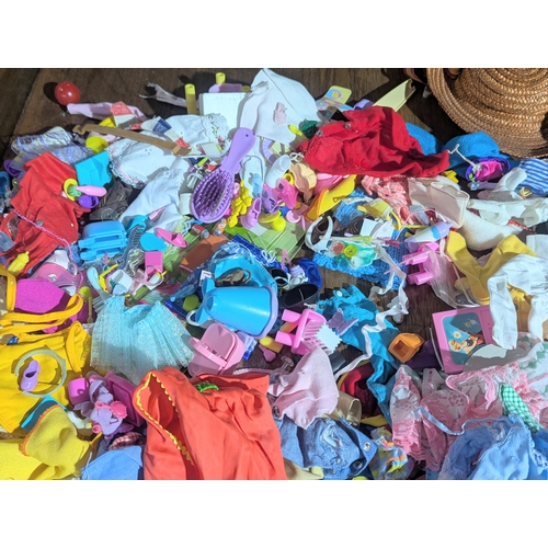 54 - A large collection of vintage doll clothes, accessories, etc. Barbie, Sindy, etc