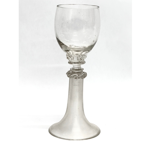 19 - A set of four 18th Century wine glasses with threaded columns and bases. 18.5cm.