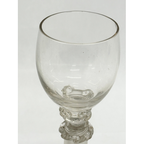 19 - A set of four 18th Century wine glasses with threaded columns and bases. 18.5cm.