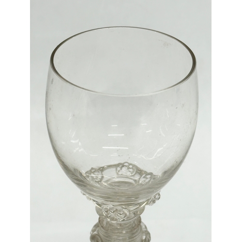 19 - A set of four 18th Century wine glasses with threaded columns and bases. 18.5cm.