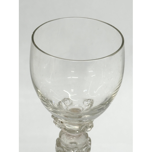 19 - A set of four 18th Century wine glasses with threaded columns and bases. 18.5cm.