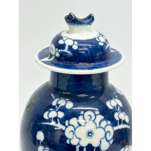 15 - A Chinese prunus pattern jar with cover. Kangxi mark. 27cm