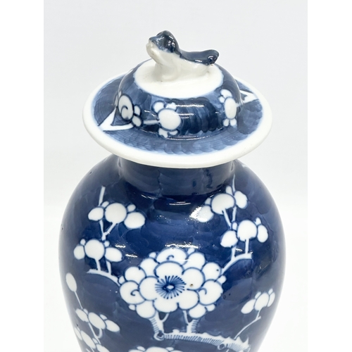 56 - A Late 19th Century Kangxi Revival prunus jar with cover. 27cm