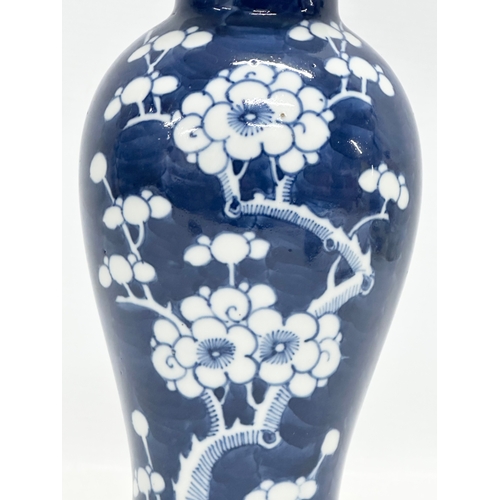 56 - A Late 19th Century Kangxi Revival prunus jar with cover. 27cm