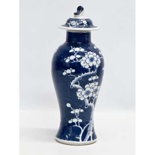 56 - A Late 19th Century Kangxi Revival prunus jar with cover. 27cm