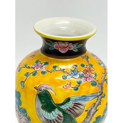 57 - A Japanese, Meiji Period baluster vase. With pheasant and flower motif on a yellow ground. Meiji Per... 