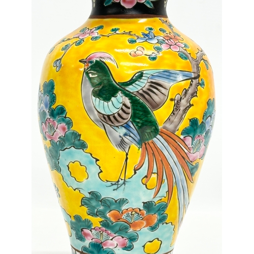 57 - A Japanese, Meiji Period baluster vase. With pheasant and flower motif on a yellow ground. Meiji Per... 