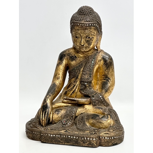 55 - A pair of 19th Century Burmese carved and giltwood seated Mandalay Buddha statues. 21x17x26cm