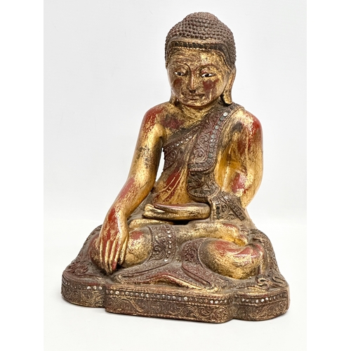 55 - A pair of 19th Century Burmese carved and giltwood seated Mandalay Buddha statues. 21x17x26cm