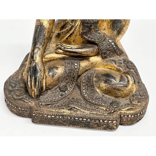 55 - A pair of 19th Century Burmese carved and giltwood seated Mandalay Buddha statues. 21x17x26cm