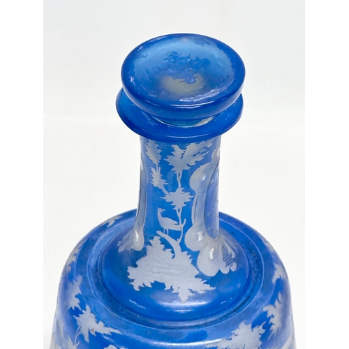 440 - A Late 19th Century Bohemian blue overlay glass decanter. Inscribed M.S. 20cm