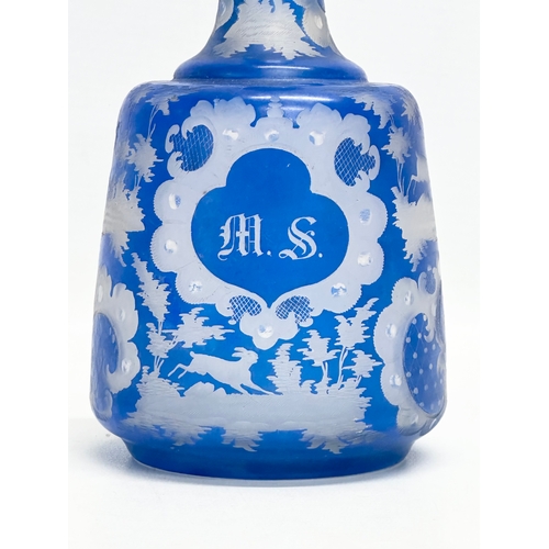 440 - A Late 19th Century Bohemian blue overlay glass decanter. Inscribed M.S. 20cm