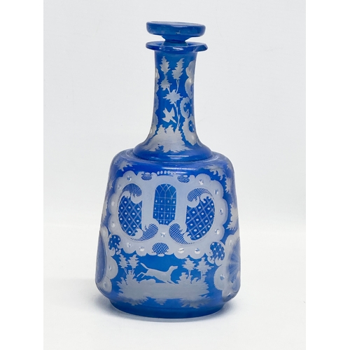 440 - A Late 19th Century Bohemian blue overlay glass decanter. Inscribed M.S. 20cm