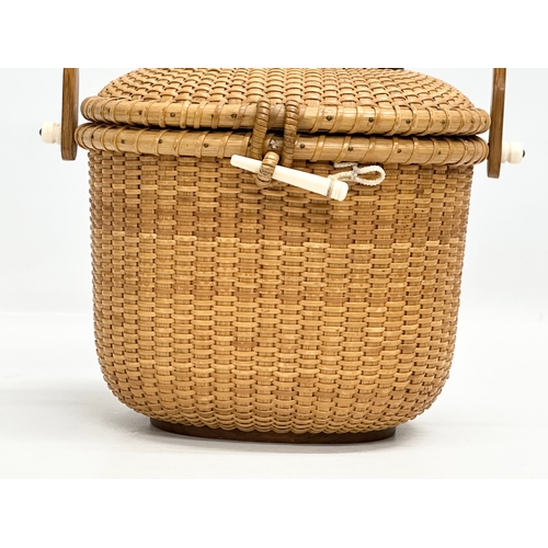 2 - Stanley M Roop Nantucket. A 1970’s wicker friendship basket. Nantucket. With whale bone and rosewood... 