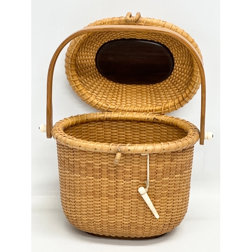 2 - Stanley M Roop Nantucket. A 1970’s wicker friendship basket. Nantucket. With whale bone and rosewood... 