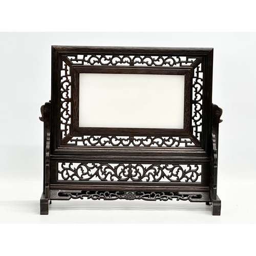 67 - An Early 20th Century Chinese carved padauk table screen, with jade panel. 35x12x32cm