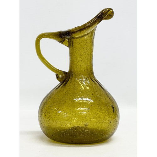 443 - A 20th Century controlled bubble glass jug. 18th Century style. 21cm