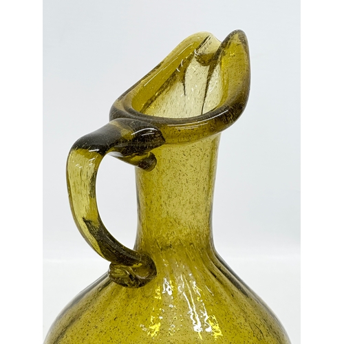 443 - A 20th Century controlled bubble glass jug. 18th Century style. 21cm