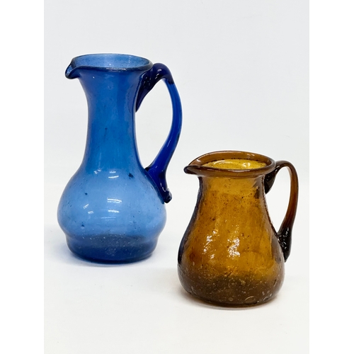 445 - Two 18th Century style glass jugs. 15cm. 9cm