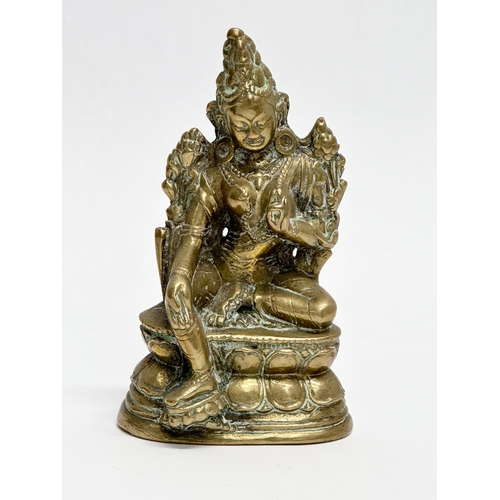 446 - A small Late 19th/Early 20th Century Indian brass Maitreya statue. 11.5cm