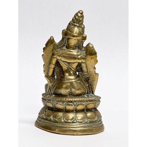 446 - A small Late 19th/Early 20th Century Indian brass Maitreya statue. 11.5cm