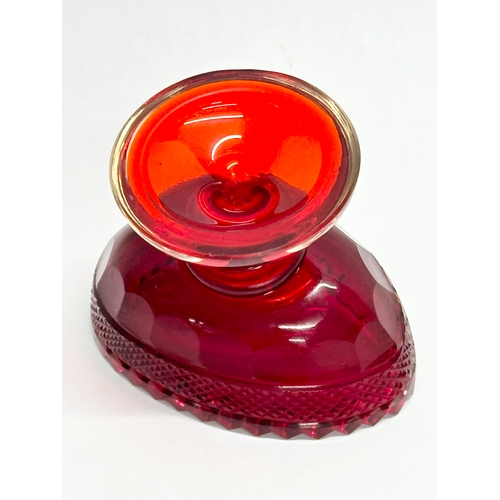 436 - A pair of 19th Century Anglo Irish ruby glass salt cellars. 8.5x6x7cm.