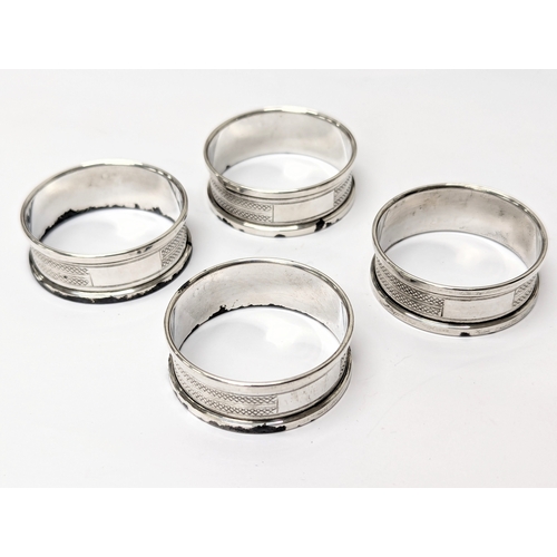 739 - A set of 4 silver napkin rings by Henry Griffith & Sons Ltd. Sheffield, 1977. Total weight 43.5g