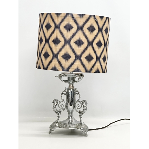 679 - George Wish. An Early 20th Century plated table lamp. Stamped G.W.S. George Wish. 35cm. 50cm with sh... 