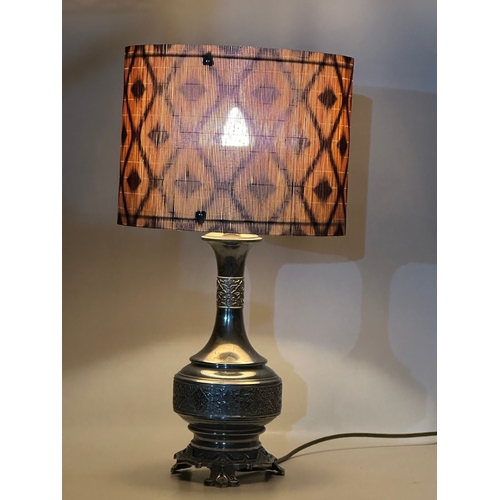 680 - The Silverlight Company Limited. A large embossed plated French table lamp. 56cm with shade. Base 41... 