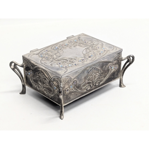 776 - An Art Nouveau jewellery box with a collection of coins including Queen Elizabeth Silver Jubilee.