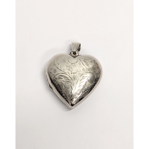 742 - A silver locket. 13.3g