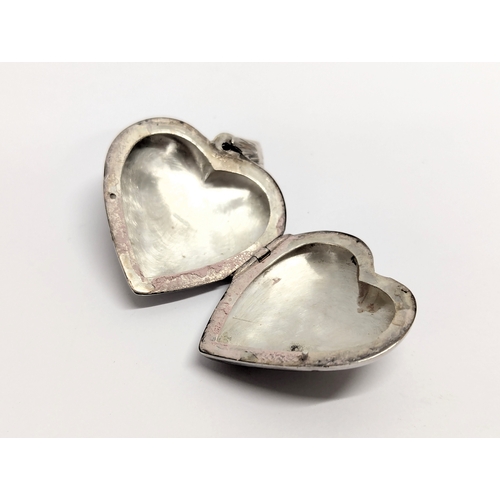 742 - A silver locket. 13.3g