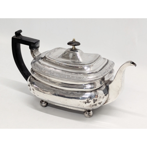 725B - An Early 19th Century, George III, Irish silver teapot by James Scott, Jeweller & Silversmith, Trini... 