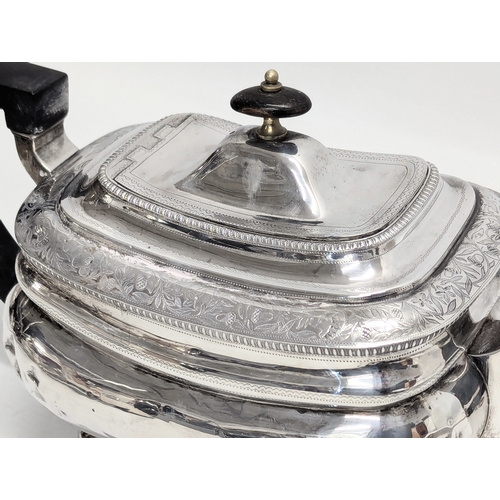 725B - An Early 19th Century, George III, Irish silver teapot by James Scott, Jeweller & Silversmith, Trini... 