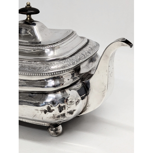 725B - An Early 19th Century, George III, Irish silver teapot by James Scott, Jeweller & Silversmith, Trini... 