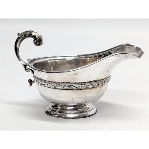 725L - An Early 20th Century silver cream jug by S. Blanckensee & Son Ltd. Birmingham, 1926. 100g. 15x9.5cm