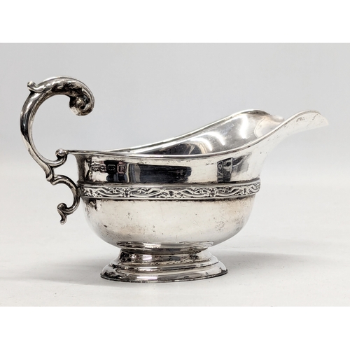 725L - An Early 20th Century silver cream jug by S. Blanckensee & Son Ltd. Birmingham, 1926. 100g. 15x9.5cm