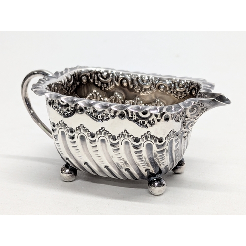 725S - A Late 19th Century, ornate Victorian silver cream jug by Atkin Brothers. Sheffield, 1894. 54g. 11x5... 