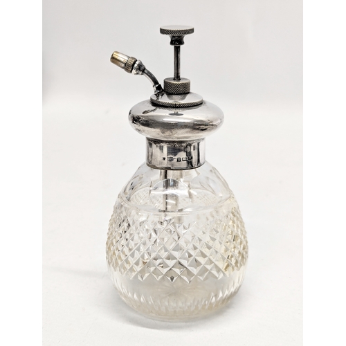 725Y - An Early 20th Century silver and glass perfume bottle. Birmingham, 1923. 15cm