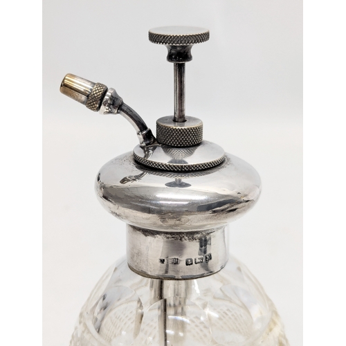 725Y - An Early 20th Century silver and glass perfume bottle. Birmingham, 1923. 15cm