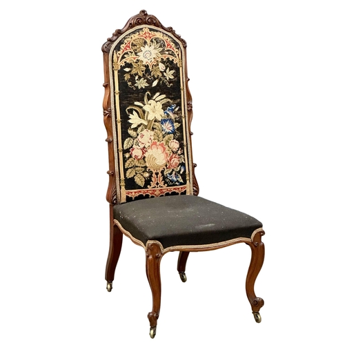 140 - A 19th Century Victorian walnut ladies chair with original needlework upholstery and carved cabriole... 