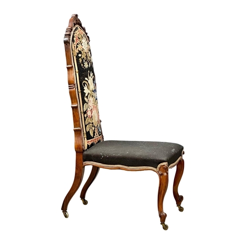 140 - A 19th Century Victorian walnut ladies chair with original needlework upholstery and carved cabriole... 