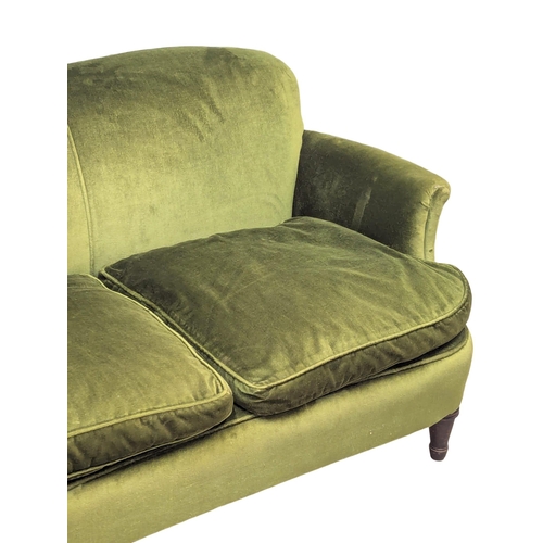 25 - An Early 20th Century 2 seater sofa with original green velvet upholstery and turned legs. With hors... 