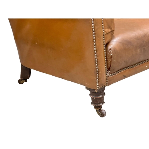 4 - A 19th Century Victorian deep button leather Chesterfield sofa, on turned mahogany legs. Circa 1880.... 