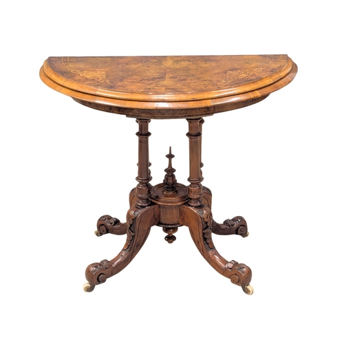 426 - A 19th Century Victorian inlaid Burr Walnut turnover games table on Cabriole legs. 93x47x74cm