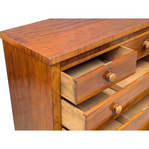 430 - A 19th Century Victorian mahogany chest of drawers with bun handles. Circa 1870/1880. 120x49x113.5cm