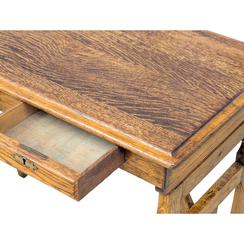 44 - An Early 20th Century oak campaign style writing desk / side table. Circa 1900. 81x45x69cm