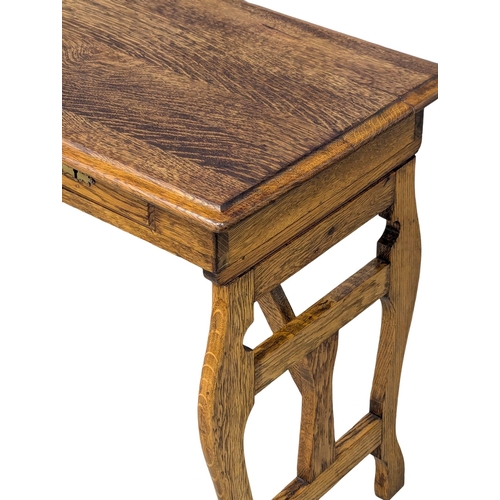 44 - An Early 20th Century oak campaign style writing desk / side table. Circa 1900. 81x45x69cm